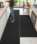Anti Fatigue Kitchen Mat Set Of 2 Cushioned Foam Rubber Runner Mats 24 By 59 Inch And 24 By 94 Inch Waterproof Oil Proof No Slip Easy Clean Front Sink Standing Comfort, visible installed on kitchen floor, with a person standing on them for support during kitchen activities.