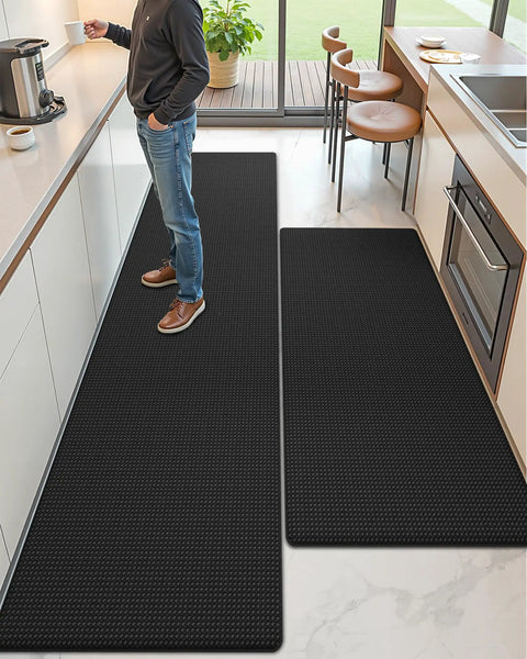 Anti Fatigue Kitchen Mat Set Of 2 Cushioned Foam Rubber Runner Mats 24 By 59 Inch And 24 By 94 Inch Waterproof Oil Proof No Slip Easy Clean Front Sink Standing Comfort, visible installed on kitchen floor, with a person standing on them for support during kitchen activities.