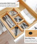 Open kitchen drawer with Modular Bamboo Drawer Organizer Set With Magnetic Containers And Removable Inserts, showing utensil storage.