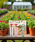 Six Piece Mini Seed Spreader Set For Tiny Seeds with handheld dispensers, dibber, and widger, displayed in a garden setting.