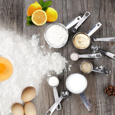 11 Piece Stainless Steel Measuring Spoons And Cups Set With Engraved Metric And Imperial Markings And Stackable Design For Everyday Cooking Baking Dry And Liquid Ingredients Great Gift stainless steel measuring cups and spoons with flour, milk, and eggs