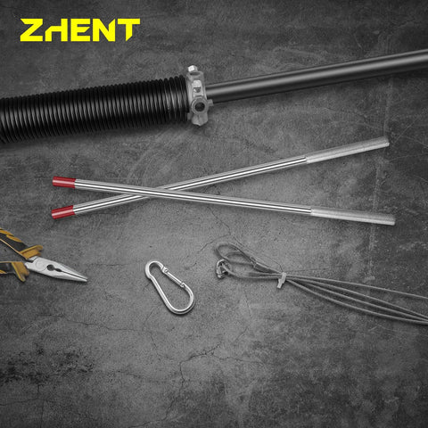 Two Pack Winding Bars For Garage Door Torsion Springs One Half Inch Diameter By Seventeen Point Five Inch Length Heat Treated Forty Five Steel With Knurled Non Slip Handle Handy Heavy Duty DIY Tool For Safe Tensioning And Unwinding displayed on concrete surface next to pliers and carabiner, highlighting tool use.