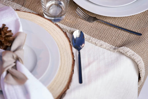 Rustic table setting with a plate on a wood slice from Ten 13-14 Inch Wood Slices For Go-To Centerpieces Set Of 10