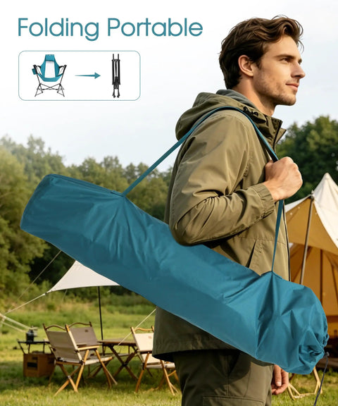Person carrying blue bag with Two Pack Hammock Camping Chairs With Stand And Storage Bag, outdoors near tents and chairs.
