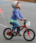 Child on red bike with colorful wheel spokes from 180 Pcs Spoke Skins And Covers In 10 Dope Color Mix For Bikes Wheelchairs And More Motocross Motorcycle BMX MTB Road And Mountain Wheel Decoration And Protection Kit.