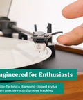 Close-up of Audio-Technica stylus on Electrohome Montrose Vinyl Record Player with precise record groove tracking.