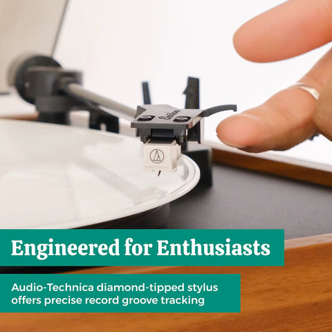 Close-up of Audio-Technica stylus on Electrohome Montrose Vinyl Record Player with precise record groove tracking.