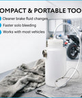 Mission Automotive brake bleeder kit, white 16 oz plastic bottle with clear hose, front view on workshop bench.