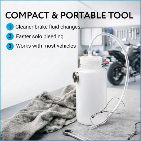 Mission Automotive brake bleeder kit, white 16 oz plastic bottle with clear hose, front view on workshop bench.