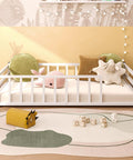 Toddler Floor Bed With Rails And Door, Montessori Low Profile Metal Platform Bed For 2 To 5 Years Old in white with plush toys.