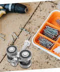 Top Shelf Stainless Steel Sliding Door Wheels Replacement Kit Featuring Dual Bearing Pulleys on work surface with screws.