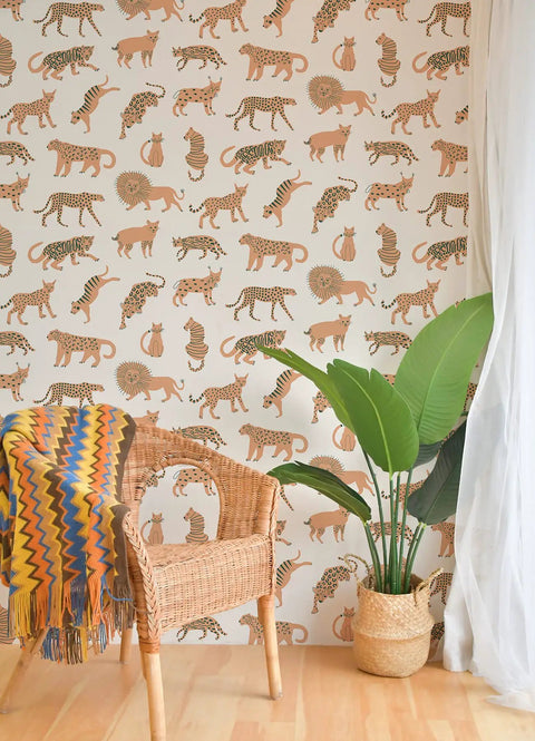 Bright Tangerine Kitty Kitty Peel And Stick Wallpaper In Off White With Exotic Cat Pattern in living room with chair and plant