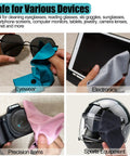 Solid-color microfiber cleaning cloths in blue, gray, pink, and black for wiping eyeglasses, electronics, cameras, and helmets.