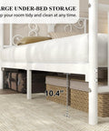 Full Size Metal Bed Frame Featuring Sculpted Butterfly Pattern Headboard In Shimmering White Polished Finish with under-bed storage space.