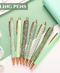 Seven Glitter Pens Set For Women with Ten Black Ink Refills Cute Sparkly Ballpoint Pens in Seven Designs on Table