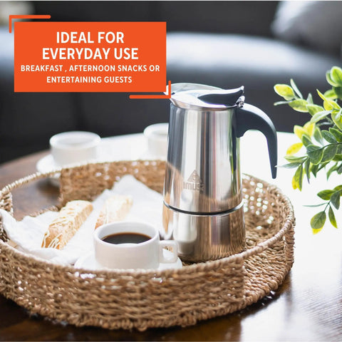 Stainless Steel Stovetop Espresso Coffeemaker SixCup Silver For Bold Home Brews Like A Pro on a tray with coffee and snacks