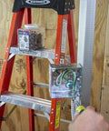 Electrician installing 3/8 In Flex 90 Degree Connector For FMC Metal Clad And Armored Cable To Steel Outlet Box Secure Bonding