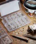 Close-up of All In One Watch Case Gasket Kit With 200 Gaskets And 40 Screws For 2824 2836 284 Movements on a wooden table