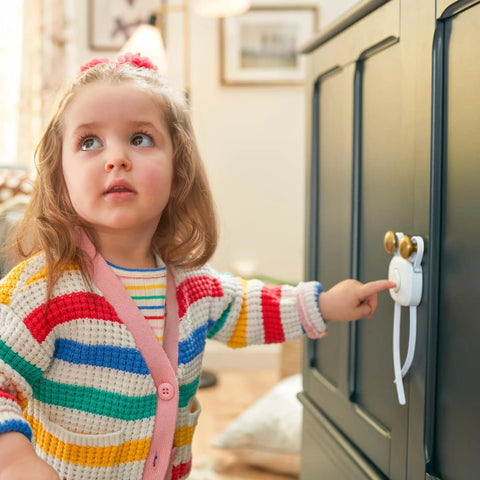 OutSmart Flex Lock Childproof Cabinet Locks White 2 Pack With Decoy Button And Flexible Design No Drill Install Fits Cabinets From 3 To 8 Inches Apart On Knobs Or Handle Pulls Easy To Install And Keep Curious Toddlers Safe