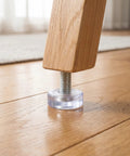 40 Piece Adjustable Furniture Feet With M6 Thread 18mm Diameter Leveling Screws For Desk And Tables, shown under a wooden leg