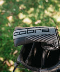 Classic Blade Putter With CNC Machined Face For Precision, Soft Feel And Tour Inspired Alignment in golf bag on grassy field.