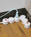 Flexible Surge Protector Power Strip With Four 3 Pin Grounded Outlets Two USB Ports Delivering 3 1A Total White Finish Six Foot Cord