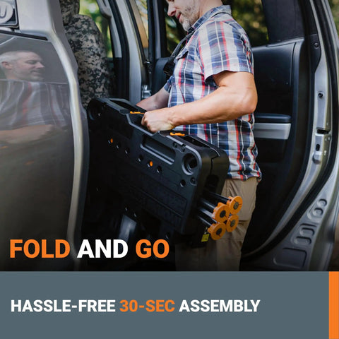 Man lifting Sidekick Folding Work Table Portable All-In-One Work Bench into car, emphasizing foldable and portable design for easy transport.