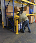 Heavy Duty Steel Safety Bollard Standing 42 Inches High By 5.5 Inches Wide In Bright Powder Coated Yellow for warehouse vehicle impact protection.
