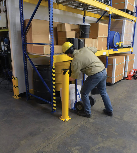 Heavy Duty Steel Safety Bollard Standing 42 Inches High By 5.5 Inches Wide In Bright Powder Coated Yellow for warehouse vehicle impact protection.