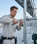 Worker using 630-Piece Pop Rivets Assortment Kit with Aluminum Blind Rivets and Steel Mandrel on metal scaffolding