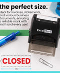 Heavy Duty Self Inking Rubber Office Stamp Printing Crisp Closed Messages In Bold Red Ink With A Quick Swap Replaceable Pad on a desk.