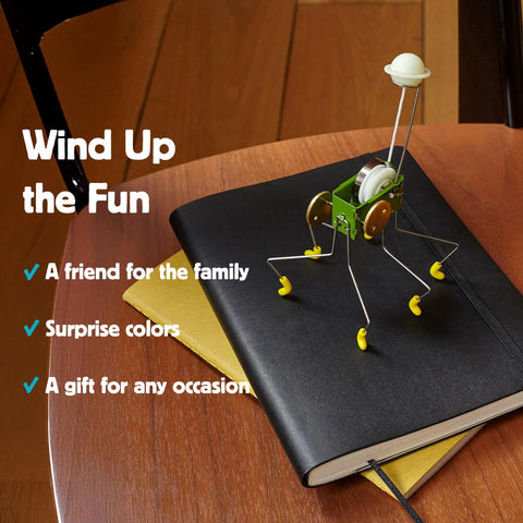 Wind Up Office Desk Pet Toy For Home And Work Cute Dancing Companion That Walks Across The Table on a notebook