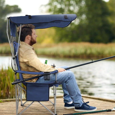 Man fishing in an Oversized Camping Chair With Canopy For Full Sun Protection, Ultra Comfy Portable Folding Chair With Armrests.