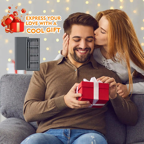 Man receiving 25-In-1 Mini Precision Screwdriver Set For Electronics And Gadgets as a gift from woman on sofa