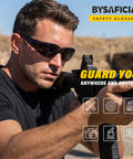 Bulk Pack Of Twenty Four Tinted Safety Glasses With Smoke Lenses And UV Protection Premium Polycarbonate Build Meets Ansi Z87 Standards worn by a man shooting outdoors.