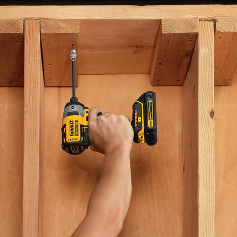Using FlexTorq Magnetic Bit Holder for Impact Tools, 2 Inch Length, on a wooden frame for secure fastening with flex and magnetic lock.