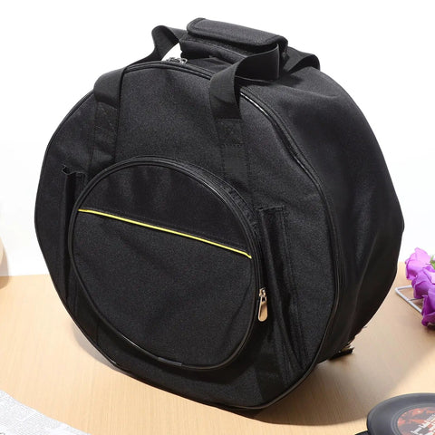 Road Ready Snare Drum Case And Gig Bag With Badass Thickened Padding And Adjustable Shoulder Strap For Smooth Hauling Of Your 14 Or 15 Inch Snare In Sleek Matte Black, shown from side angle.