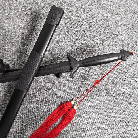 Tai Chi Sword Training Katana Style Practice Sword, 99cm High Elastic Polypropylene Blade With Scabbard And Red Tassel displayed on carpet