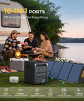 Beefy 6144Wh Portable Power Station Paired With Two 200W Foldable Solar Panels for outdoor cooking setup by a lake.