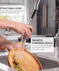 FORIOUS Kitchen Faucet with Pull Down Sprayer, High Arc, Brushed Nickel 18-inch reach in use for rinsing a wooden plate.