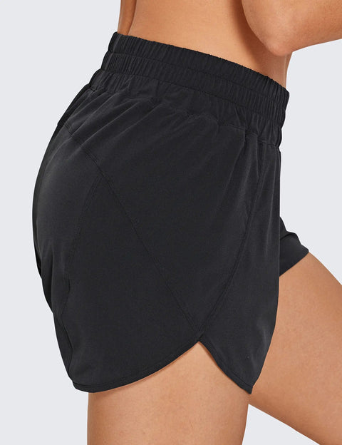 Side view of black Dolphin Hem Athletic Shorts, 3 inch inseam, high rise, ultra soft lightweight quick dry fabric, comfy dolphin hem.