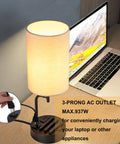 Bedside Table Lamp With Three USB Ports And AC Outlet Cream next to laptop, charging hub for all your devices, modern desk lamp.