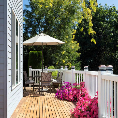 Badass Composite Decking Fastener Kit With 100 Nylon Hidden T Clips And 304 Stainless Steel Start Clips Including 108 Screws Plus 2 Drive Bits For 55 Sq Ft Universal Deck Board Installation Project on a sunny deck with flowers.