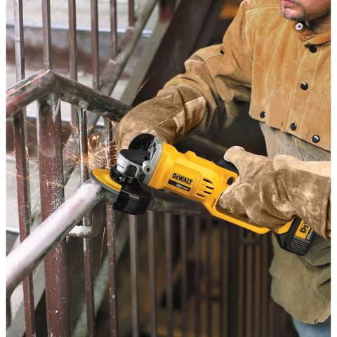 DeWALT DCG412B 20V MAX cordless 4-1/2in grinder grinding metal railing; yellow tool with battery.