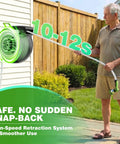 Man using Retractable Garden Hose Reel 100 ft Half Inch Wall Mounted Auto Rewind with Tangle Free Guide in backyard