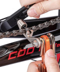 Portable Bicycle Repair Multi Tool With Chain Tool Torx Hex And Screwdriver For Road And Mountain Bikes held on chain link