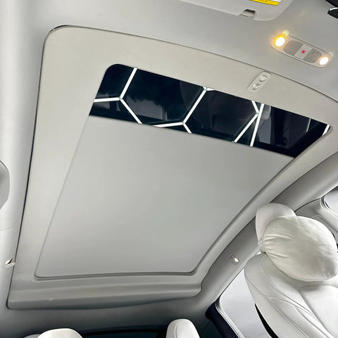 Interior view of Tesla Model Y showing Compatible With 2020 To 2025 Model Y Electric Retractable Sunroof Sunshade.