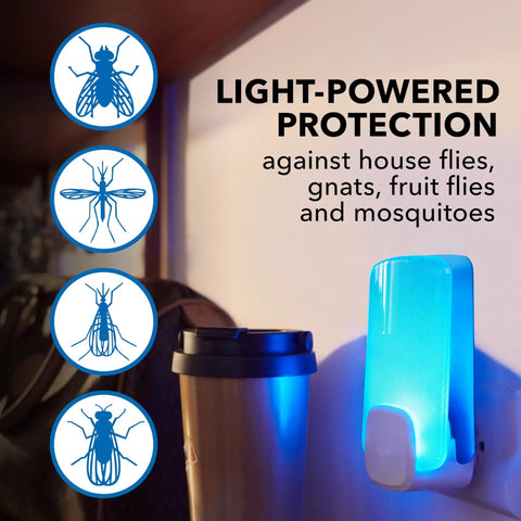 Flying Insect Light Trap Starter Kit With Easy Plug In Device And Replacement Cartridge Kid Friendly And Pet Safe Chemical Free Home Insect Control Light Powered Attraction For Any Room shown mounted on wall near a coffee cup.