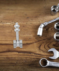 Heavy Duty Stainless Steel V Groove Sliding Door Pulley Wheel Featuring Dual Ball Bearings Built Ridiculously Tough on wood surface with tools.