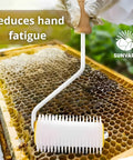 Pro Grade Honey Uncapping Roller Tool for Beekeepers on honeycomb frame with sharp plastic prongs and easy grip handle